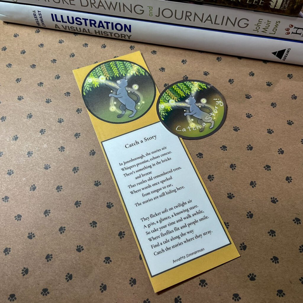 Catch a Story poem bookmark with matching sticker, placed on paw-print paper with illustration books in background.