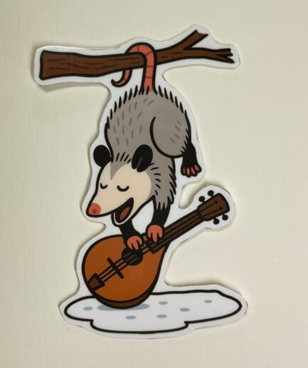 Possum Playing Mandolin vinyl sticker featuring a possum hanging upside down and playing a mandolin